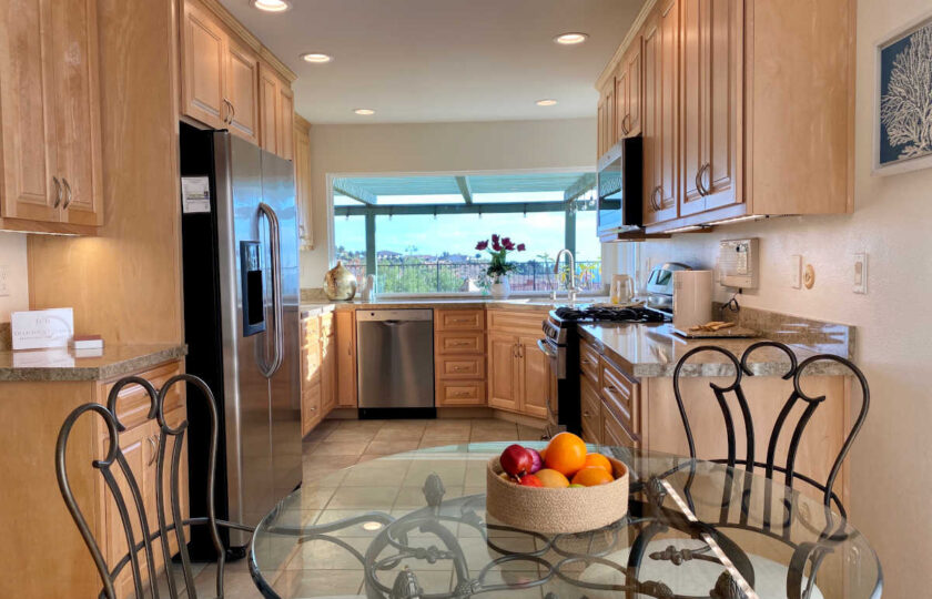 Transitional home staging design of kitchen in Ventura 4 bed, 3 bath home