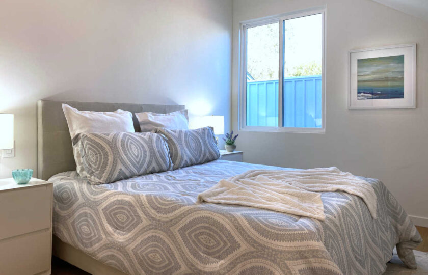 Boho Chic beach house home staging at Faria Beach, second guest bedroom facing grey queen bed