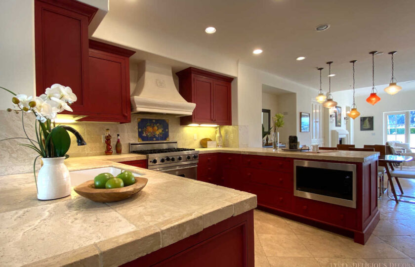 Kitchen with traditional cabinetry and tile, showing small scene stagings on kitchen counters