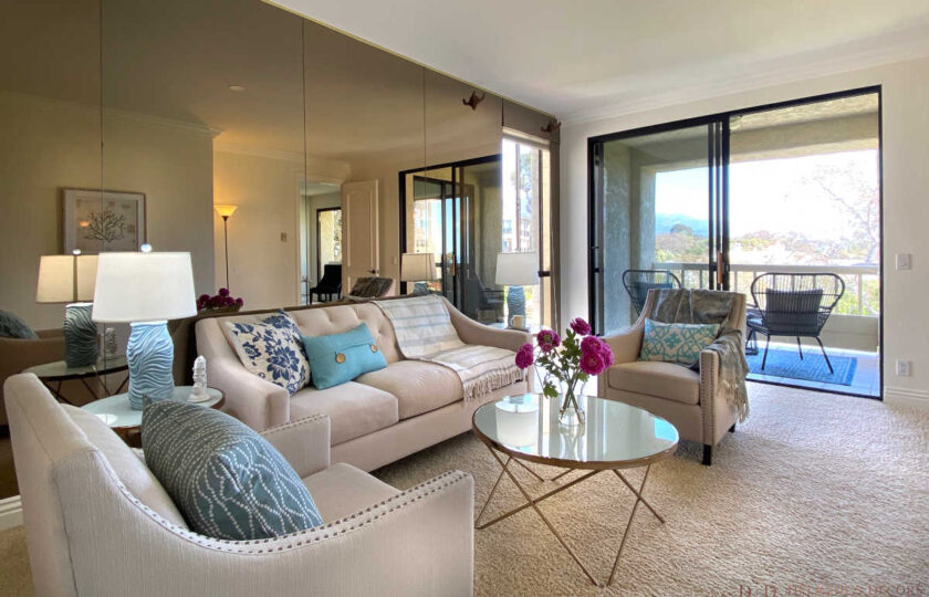 Transitional home staging design of family room, facing patio and views, in Montecito Shores two bedroom condo