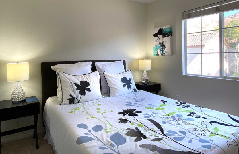 guest bedroom with floral bedding and two nightstands