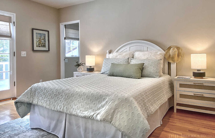 Santa Barbara home staging in San Roque featuring an elegant, circular patterned bedding backed by a shabby-sheek panel headboard