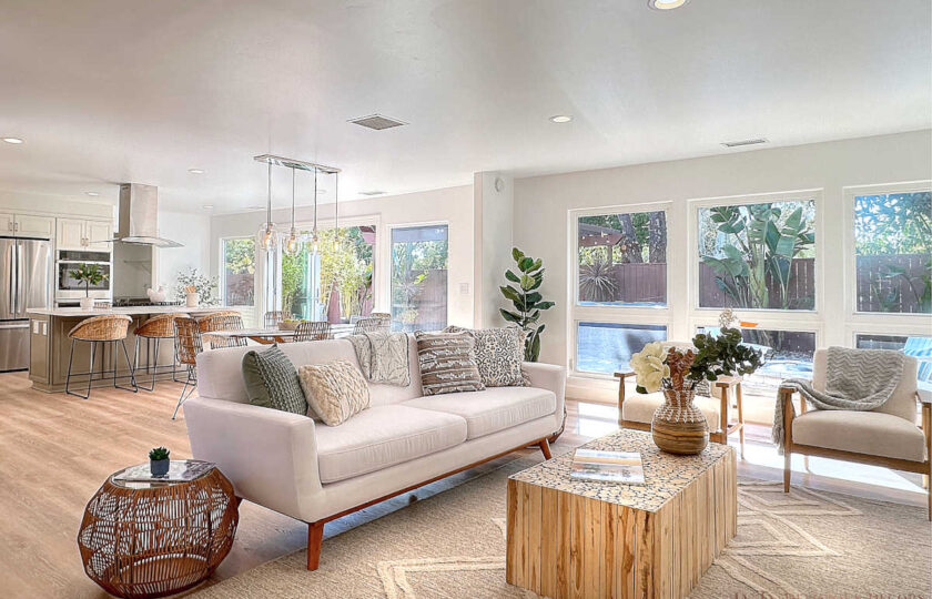 Delicious Decors' California Comfort home staging design blends organic materials with light upholstered furniture, neutral accents, and modern flair.
