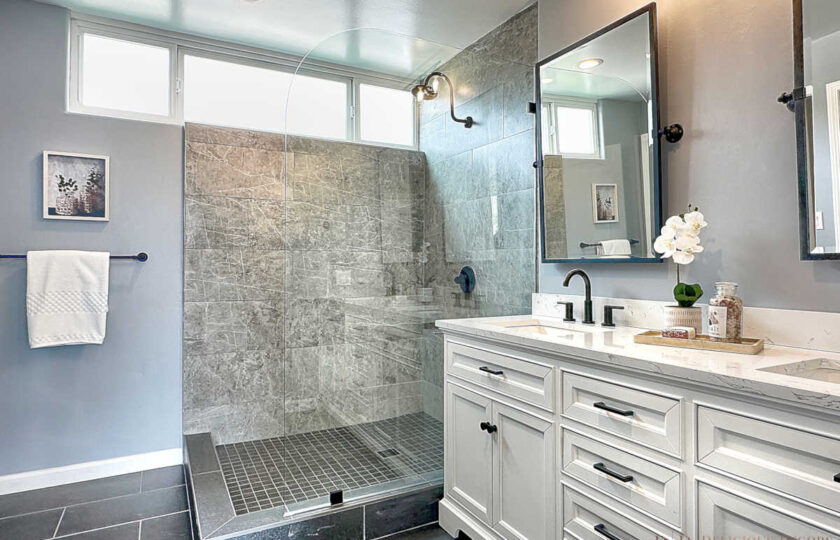 Shaker cabinetry in the bathroom combined with contemporary remodeled shower.