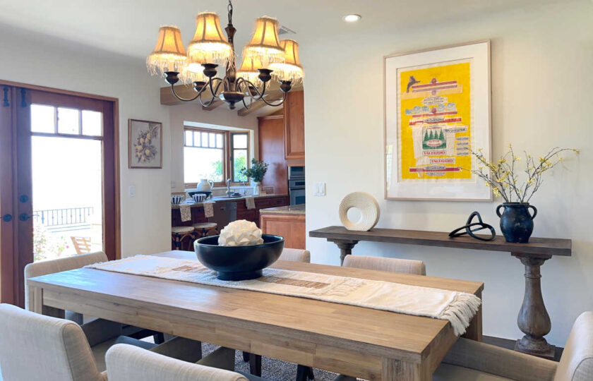 The dining room staging features original art by J.J. L'Heureux that makes use of vintage Sergio Arrigoni Taleggio cheese packaging.