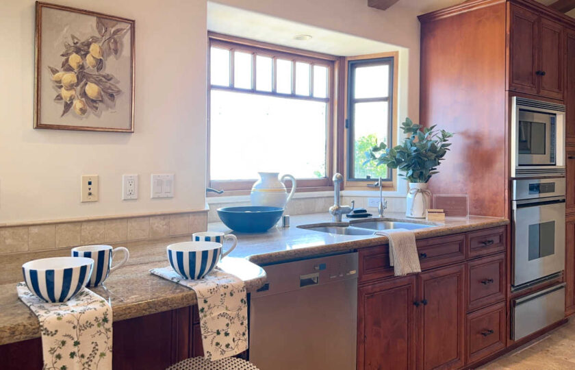 Lemons give a fresh, Italian feel to this quintessential Mediterannean Revival home staging design.